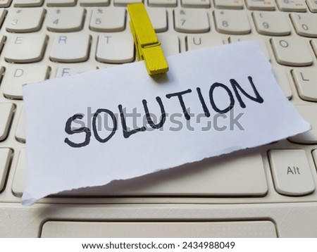 Solution writting on laptop keyboard background.
