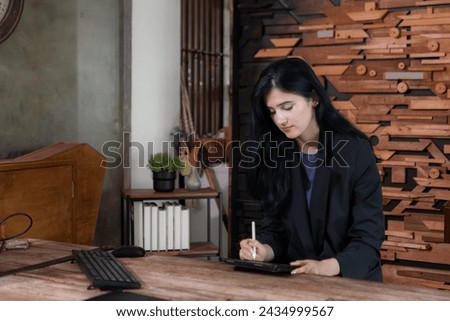 Portrait of professional businesswomen working on tablet in a modern office room