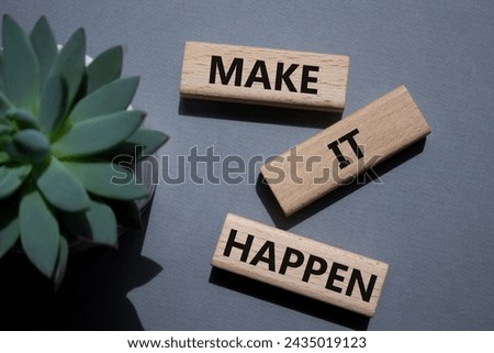 Make it Happen symbol. Concept words Make it Happen on wooden blocks. Beautiful grey background with succulent plant. Business and Make it Happen concept. Copy space.