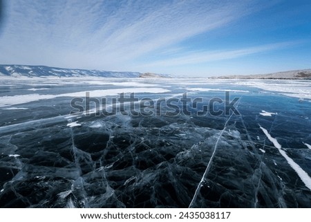 Lake Baikal in winter, the deepest and largest freshwater lake by volume in the world, located in southern Siberia, Russia Royalty-Free Stock Photo #2435038117