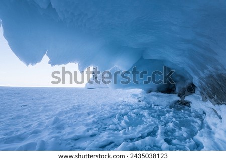 Coast of lake Baikal in winter, the deepest and largest freshwater lake by volume in the world, located in southern Siberia, Russia Royalty-Free Stock Photo #2435038123