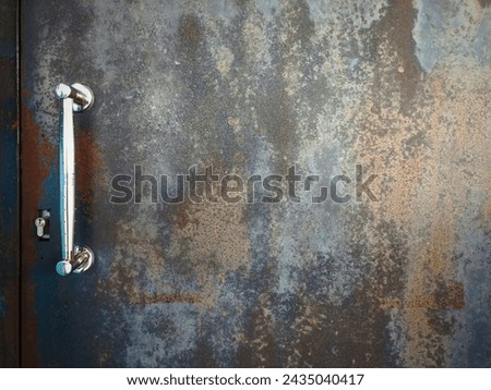 rusty iron door... looks unkempt... Royalty-Free Stock Photo #2435040417