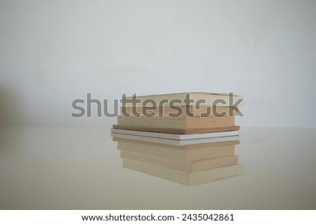 some books on a white table
