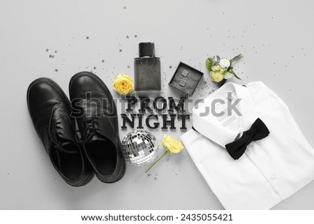 Words PROM NIGHT with male shoes, shirt and perfume bottle on white background