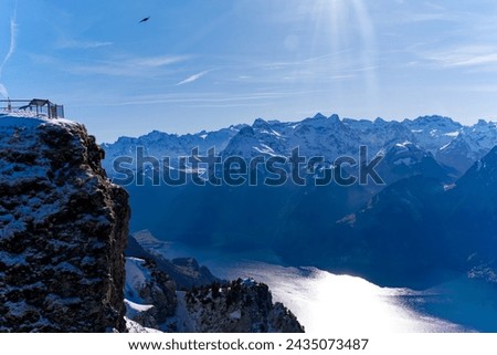 Aerial view of mountain panorama with  Lake Lucerne on a sunny winter day seen from peak named Fronalpstock at Stoos Alp. Photo taken February 13th, 2024, Stoos, Canton Schwyz, Switzerland.