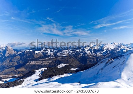 Scenic view of mountain panorama in the Swiss Alps with ski slope seen from Klingenstock at Stoos Alp on a sunny winter day. Photo taken February 13th, 2024, Klingenstock, Stoos, Switzerland.