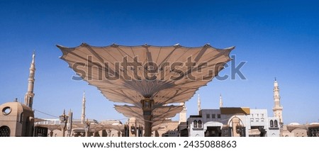 Shading umbrellas of the Prophet's Mosque in Al Haram area of Medina, Saudi Arabia Royalty-Free Stock Photo #2435088863
