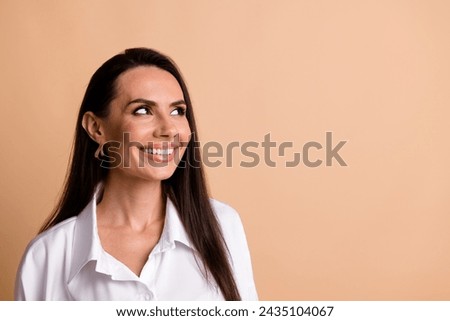 Photo of positive nice corporate lady beaming smile look empty space brainstorming isolated on beige color background