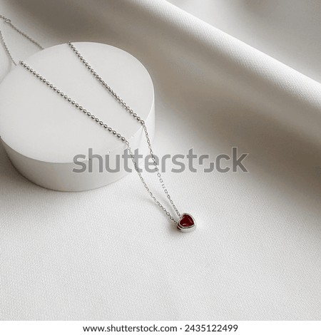 Silver mini heart birthstone necklace. Royalty-Free Stock Photo #2435122499