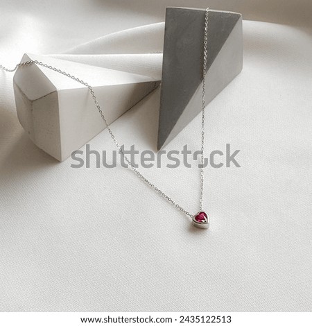 Silver mini heart birthstone necklace. Royalty-Free Stock Photo #2435122513