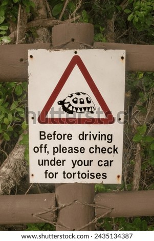 Warning sign to check for wild tortoises before driving in South Africa