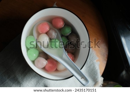 Tang Yuan is a Chinese dessert made of glutinous rice flour balls served in sweet soup. It's enjoyed during festivals like the Winter Solstice. Selective focus Royalty-Free Stock Photo #2435170151