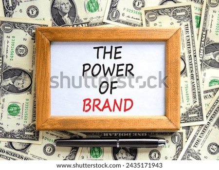 The power of brand symbol. Concept words The power of brand on beautiful wooden frame. Black pen. Beautiful dollar bills background. Dollar bills. Business the power of brand concept. Copy space.