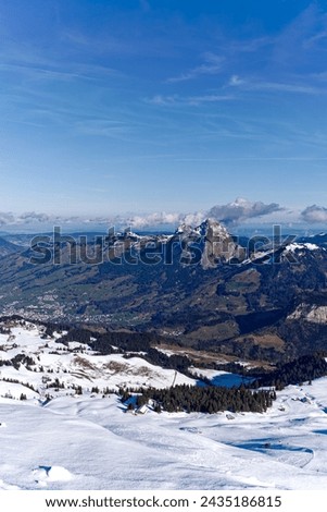 Mountain panorama with twin peaks Mythen at sunny winter day seen from peak named Fronalpstock at Stoos alp. Photo taken February 13th, 2024, Stoos, Canton Schwyz, Switzerland.