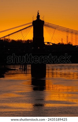 View of Roebling bridge at sunset from Kentucky.