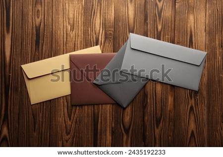 Creative layout of colored envelopes on wooden boards