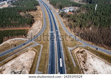 Expressway among forests, view from a drone.