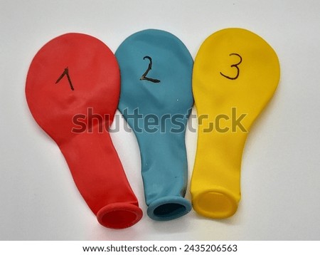 123 number on colorful balloons with white background. Royalty-Free Stock Photo #2435206563