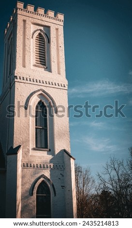 this is a picture of an old church, with a nice blue sky in the background. 