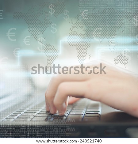 Business man pressing buttons on laptop