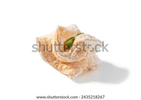 A delightful treat featuring flaky puff pastry filled with green Turkish Delight and dusted with a veil of powdered sugar Royalty-Free Stock Photo #2435218267