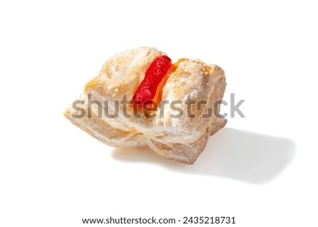 A delightful treat featuring flaky puff pastry filled with vibrant red Turkish Delight, dusted with a veil of powdered sugar Royalty-Free Stock Photo #2435218731