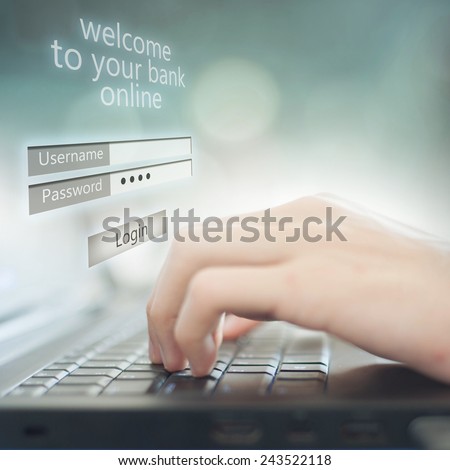 Business man pressing buttons on laptop, on the screen Welcome to your bank online Royalty-Free Stock Photo #243522118
