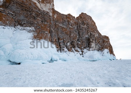 Coast of lake Baikal in winter, the deepest and largest freshwater lake by volume in the world, located in southern Siberia, Russia Royalty-Free Stock Photo #2435245267