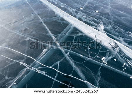 Ice of Lake Baikal, the deepest and largest freshwater lake by volume in the world, located in southern Siberia, Russia Royalty-Free Stock Photo #2435245269