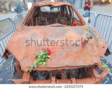 burned-out civilian car. War in Ukraine. Russian invasion of Ukraine. War crimes Royalty-Free Stock Photo #2435257373
