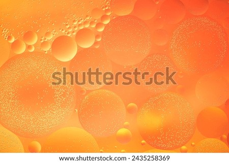 Abstract orange colorful background with oil on water surface. Oil drops in water abstract psychedelic, abstract image.