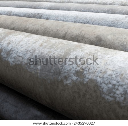 Concrete pipes. Stack of new concrete pipes. Construction material.