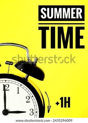 Alarm Clock at 3 o'clock changing to Summer Time.. Daylight Saving Time concept Royalty-Free Stock Photo #2435296009