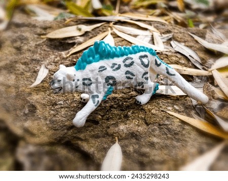 Toy tiger on a stone abstract and nature landscape