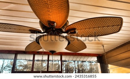 Ceiling fan installed on a summer porch Royalty-Free Stock Photo #2435316855