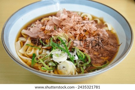 Flat udon or thick Japanese noodles with dried bonito called “Kishimen”. The soul food of Aichi Prefecture in Japan Royalty-Free Stock Photo #2435321781
