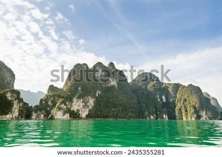 Beautiful island and green lake in summer at Ratchaprapha Dam, Khao Sok National Park, Surat Thani Province, Guilin of Thailand Royalty-Free Stock Photo #2435355281
