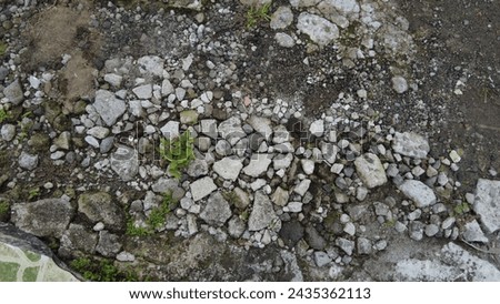 Background of rocks, sand and grass