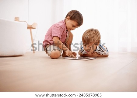 Tablet, kids and siblings on a floor with cartoon, gaming or streaming movie at home. Digital, learning and boy children in house for google it, search or ebook storytelling, app or Netflix and chill