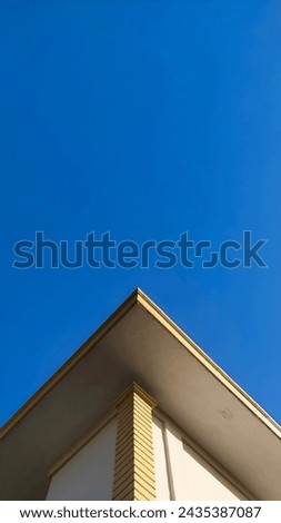 Buildings and blue sky background in symmetrical shape Royalty-Free Stock Photo #2435387087