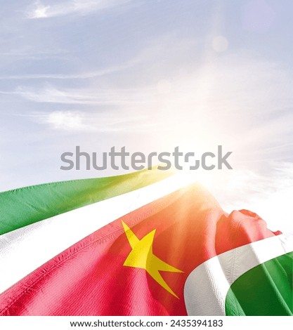 Suriname waving flag in beautiful sunlight.