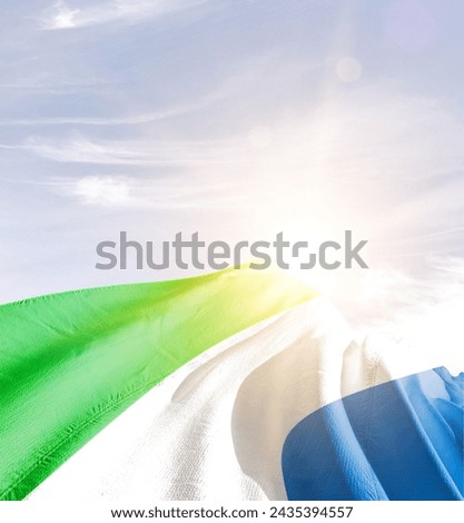 Sierra Leone waving flag in beautiful sunlight. Royalty-Free Stock Photo #2435394557