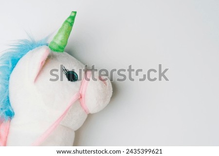 Picture of unicorn doll on white background, It is a high-growth  business idea worth over $1 billion. Start up unicorn.