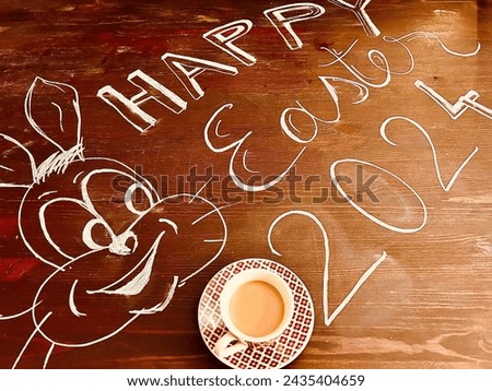 The message Happy Easter, a rabbit, the year 2024 and a cup of coffee