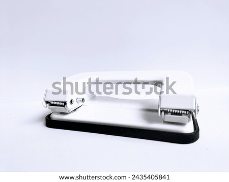 White office hole punch in the white background