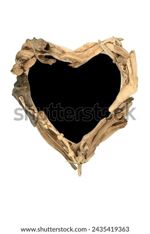 Driftwood heart shape wreath frame abstract on white background. Creative zen minimal natural wood nature composition.