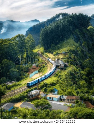 The pic is very very beautiful.The pic under a train and people sit this.This pic have a village and the other people lived in the village.Im feel Very happyness.Because,lived people are saw this pic.
