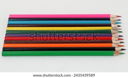 Colour pencils isolated on white background close up. Drawing supplies: assorted color pencils, isolated on white background