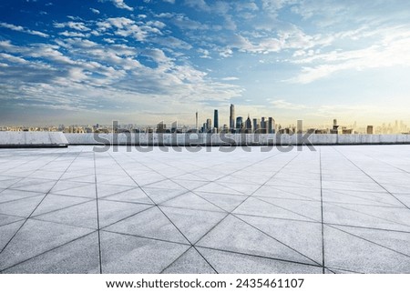 Empty square floor and city commercial buildings skyline in Guangzhou