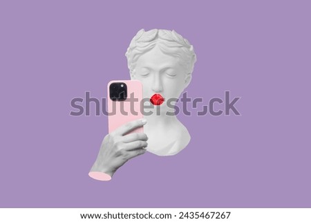 Antique statue's head with kissing red lips with a bow holding pink mobile phone taking selfie on purple color background. 3d trendy creative collage in magazine style. Contemporary art. Modern design Royalty-Free Stock Photo #2435467267